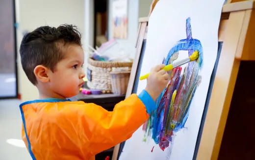 a young boy painting