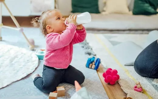 a baby drinking from a bottle