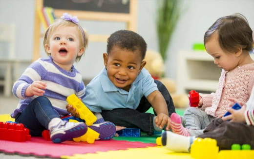 a group of children playing with toys