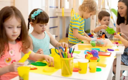 children painting on a table
