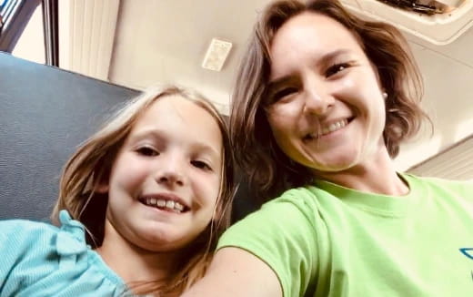 a person and a girl smiling