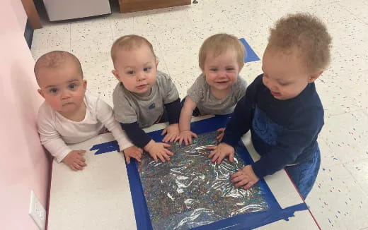 a group of children sitting on the floor