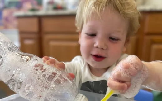 a baby holding a stuffed animal