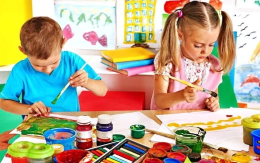 a boy and girl painting