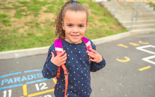 a girl holding a toy