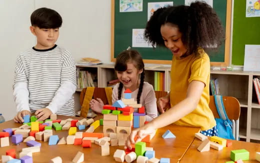 a group of children playing with blocks
