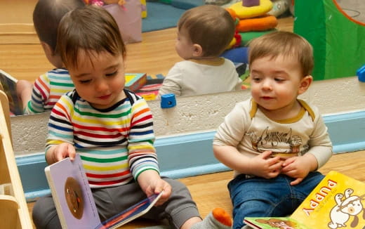 a group of children sitting on the floor