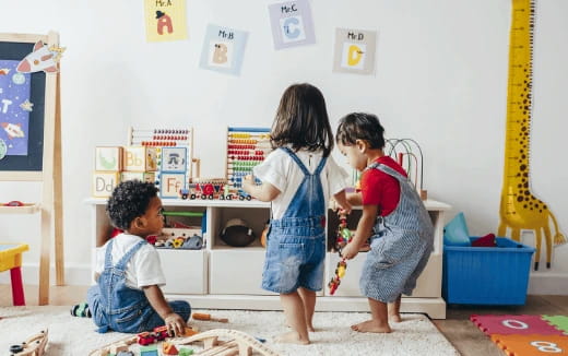 a group of children playing with toys