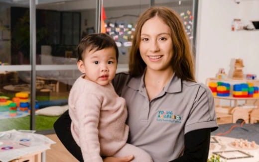a person holding a baby