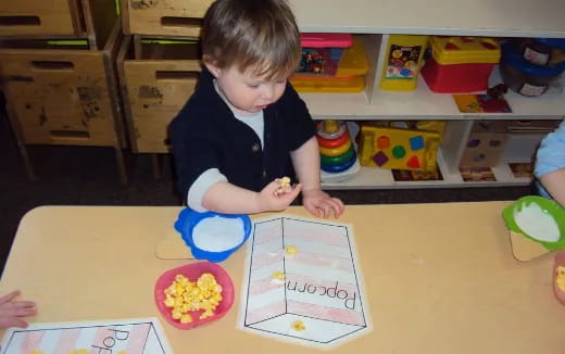 a child sitting at a table