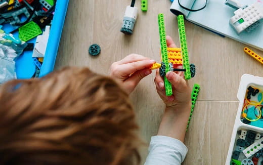 a person holding a green object