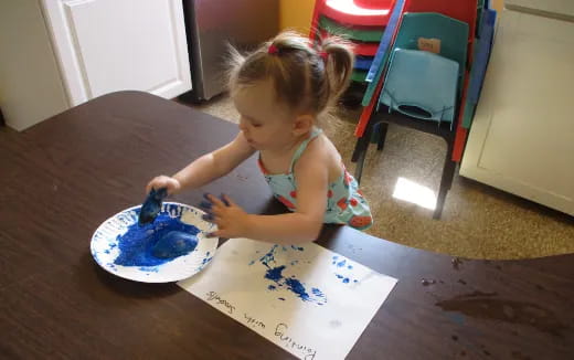 a little girl eating cake