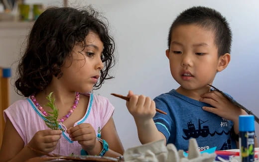 a boy and girl looking at each other