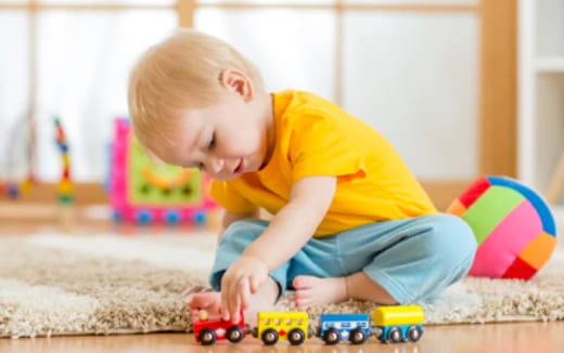 a baby playing with toys