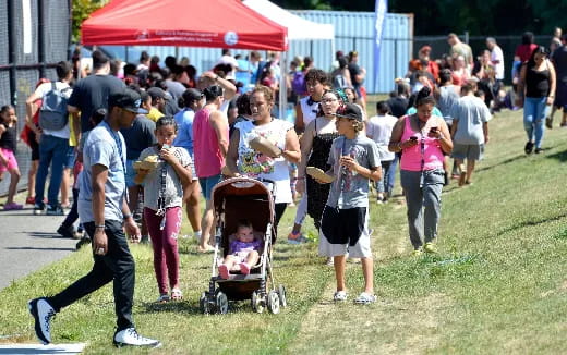 a group of people walking in a park