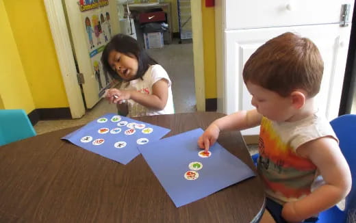 a couple of children playing with toys