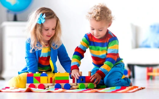 a couple of children playing with toys