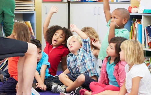 a group of children sitting in a circle