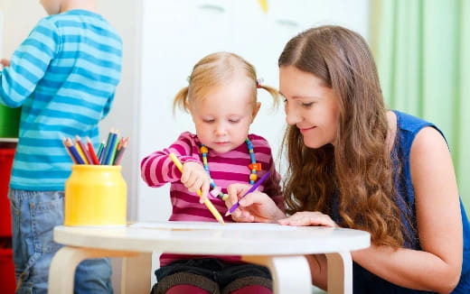 a person and a child painting