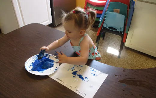 a little girl eating cake
