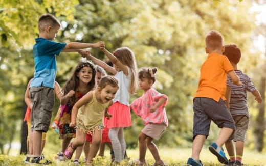 a group of children jumping in the air