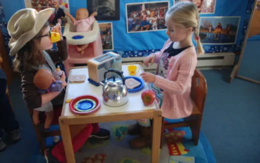 a couple of children playing with toys