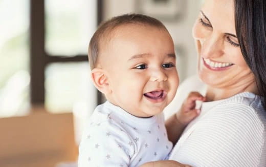 a person holding a baby