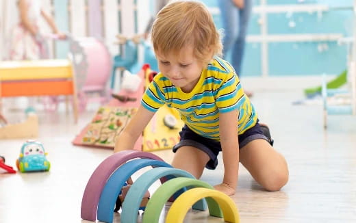 a baby playing with toys