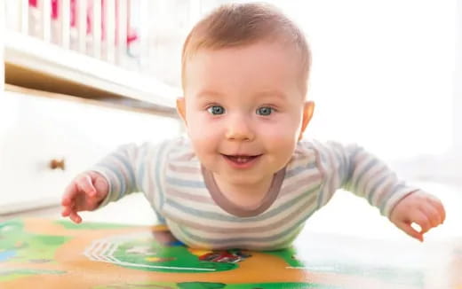 a baby crawling on a table