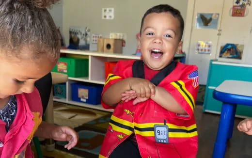 a boy holding a baby