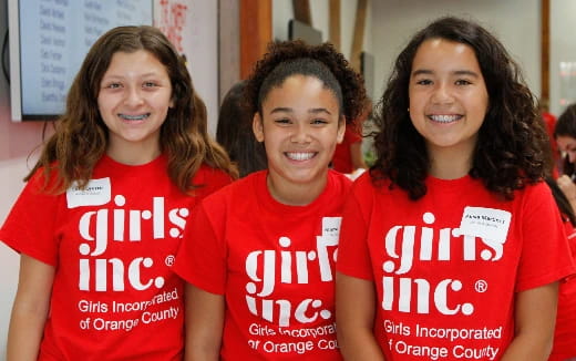 a group of women wearing red shirts