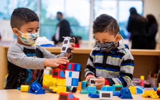 a couple of boys playing with toys