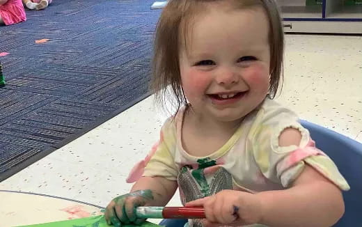 a child sitting on a chair