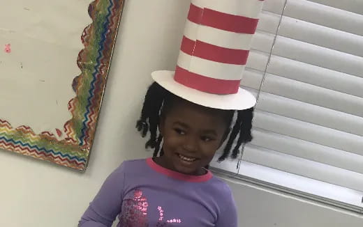 a child wearing a hat