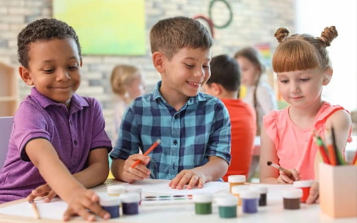 a group of children painting