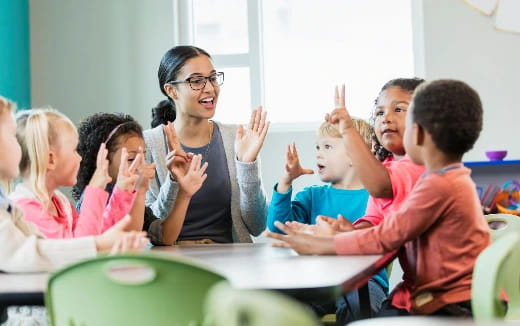 a teacher teaching her students