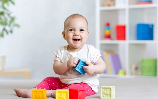 a baby sitting on a table