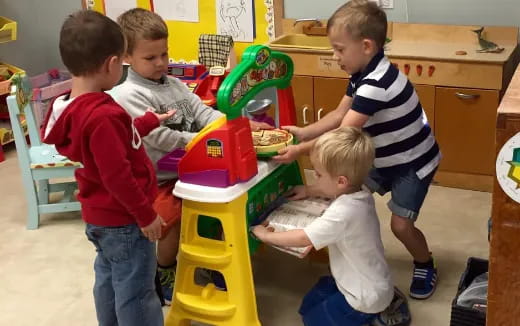 a group of kids playing with a toy