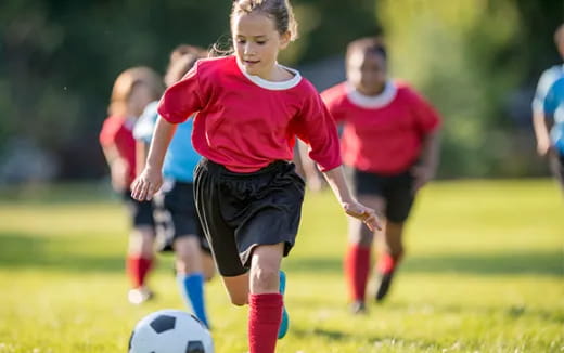 a girl playing football