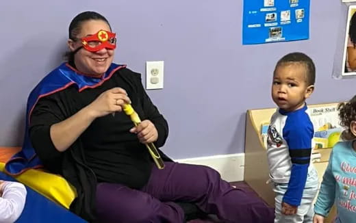 a boy holding a toy