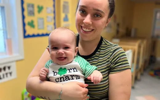 a person holding a baby