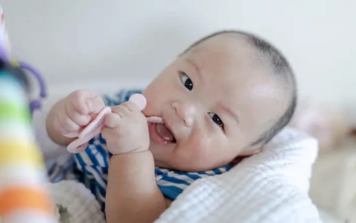 a baby with a toothbrush