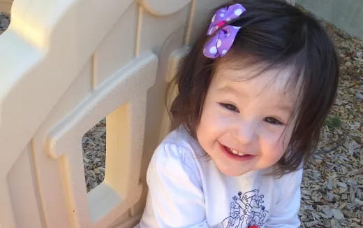 a girl smiling for the camera