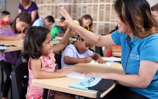 a teacher teaching her students