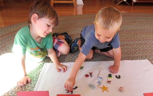 two babies playing with toys