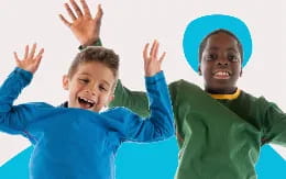 a couple of boys with their hands up