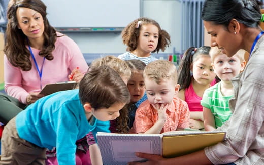 a teacher teaching her students