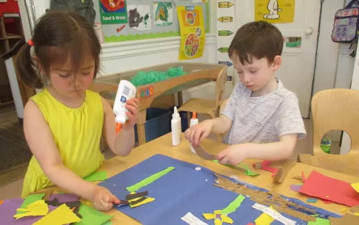 a couple of children painting