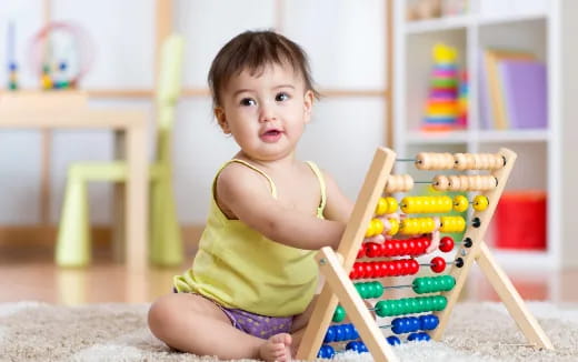 a baby playing with toys