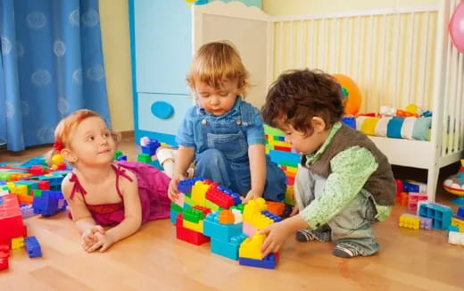 a group of children playing with toys